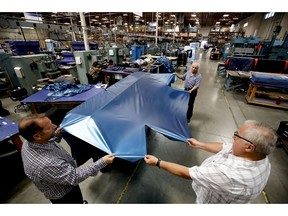 FILE - In this July 5, 2018, file photo workers assemble the Afloat water mattresses at the factory in Corona, Calif. On Wednesday, May 15, 2019, the Federal Reserve reports on U.S. industrial production for April.