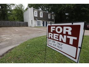FILE - In this April 23, 2018, file photo a for rent sign denotes the availability of another existing home in Jackson, Miss. Buying a home is often seen as a no-brainer if you have the means. But continuing to rent can give you more flexibility, amenities and time. It can also give you a sense of financial security, since there's no down payment, repairs or closing costs to eat through your nest egg.
