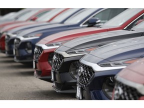 FILE - In this May 19, 2019, file photo, a line of unsold 2019 Tucson sports-utility vehicles sits at a Hyundai dealership in Littleton, Colo. On Friday, May 31, the Commerce Department issues its April report on consumer spending, which accounts for roughly 70 percent of U.S. economic activity.