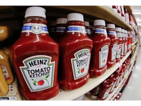FILE- This Feb. 21, 2018, file photo shows a display of Heinz Ketchup in a market in Pittsburgh. Kraft Heinz is restating financial results for 2016, 2017 and the first nine months of 2018. The company has been conducting an internal investigation after the SEC launched a probe into its procurement operations. Kraft Heinz says its investigation is 'substantially complete.'