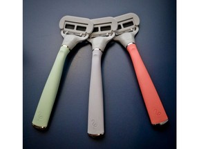 FILE- In this Oct. 11, 2018 file photo razors from Harry's shaving and body care brand Flamingo are displayed in New York. Edgewell Personal Care is acquiring upstart razor maker Harry's in a cash-and-stock deal for $1.37 billion. Edgewell and other larger personal care companies have been steadily losing market share to smaller, direct-to-consumer companies like Harry's, known for its brightly-colored disposable razors.