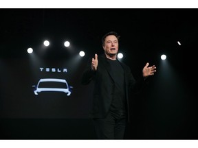 FILE- In this March 14, 2019, file photo Tesla CEO Elon Musk speaks before unveiling the Model Y at Tesla's design studio in Hawthorne, Calif. Shares of electric vehicle maker Tesla Inc. fell at the opening bell Thursday, May 23 but recovered into positive territory after an analyst predicted falling demand but Musk told employees that orders are up. The gyrations within an hour of when the markets opened were indicators of a volatile day for the shares, which have shed about 40 percent of their value this year and are trading at the lowest levels since late 2016.
