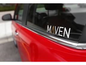 FILE - This April 27, 2016, file photo, shows the Maven logo on a General Motors car-sharing service automobile, in Ann Arbor, Mich.  General Motors is retreating from eight of the 17 North American markets where it had started a car-sharing service called Maven. The company wouldn't say where it will keep the business, but it confirmed that it's pulling out of New York and Chicago. GM says it's not scrapping Maven.