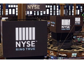 FILE- In this Aug. 21, 2018, file photo screens above trading posts on the floor of the New York Stock Exchange show the NYSE logo.  U.S. stocks rallied in morning trading on Wall Street Tuesday, May 21, after the U.S. government temporarily eased off its proposed restrictions on technology sales to Chinese companies.   (AP Photo/Mark Lennihan, File)