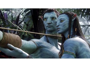 FILE - This image released by 20th Century Fox shows the characters Neytiri, right, and Jake in a scene from the 2009 movie "Avatar." The Walt Disney Co. on Tuesday laid out its plans for upcoming 20th Century Fox films. James Cameron's long-delayed "Avatar 2" will now open in theaters in December 2021 instead of its most recent date of December 2020. The two subsequent "Avatar" sequels will move to 2023 and 2025, respectively. (AP Photo/20th Century Fox, File)