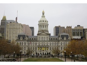 This Dec. 6, 2016, photo shows the City Hall building from the steps of the War Memorial Building in Baltimore. More than a week after a cyberattack hobbled Baltimore's computer network, city officials said Wednesday, May 15, 2019, they can't predict when its overall system will be up and running and continued to give only the broadest outlines of the problem.