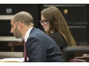 FILE - In this April 25, 2019, file photo, Anna Sorokin, right, and her lawyer Todd Spodek react as the jury foreman reads the verdict in New York. Spodek, a fake German heiress who swindled tens of thousands of dollars from New York banks and hotels, is set to learn her punishment. She faces sentencing Thursday, May 9, in Manhattan state court following her conviction for theft of services and grand larceny.