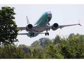 FILe - In this May 8, 2019, file photo, a Boeing 737 MAX 8 jetliner being built for Turkish Airlines takes off on a test flight in Renton, Wash. Representatives from more 30 countries met with Federal Aviation Administration officials Thursday, May 23, to hear the U.S. regulator's approach to determining how soon the Boeing 737 Max can resume flying after two crashes that killed 346 people.