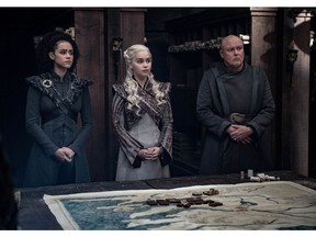 This image released by HBO shows from left, Nathalie Emmanuel, Emilia Clarke and Conleth Hill in a scene from "Game of Thrones," that aired Sunday, May 5, 2019. In the third to last episode of HBO's "Game of Thrones," Mother of Dragons Daenerys Targaryen is suffering from a crisis of confidence. She is short on troops and dragons, short on strategies and short on friends. And her claim to the Iron Throne has weakened upon learning that Jon Snow, in fact, shares her royal Targaryen blood.