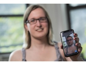 In this Wednesday, May 15, 2019, photo, Bailey Coffman shows her photo as a man in the Snapchat app during an interview in New York. Snapchat's new photo filter that allows users to change into a man or woman with the tap of a finger isn't necessarily fun and games for transgender people. But some others see the potential for such tools to lead to self-discovery among people struggling with their gender identity.