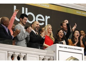 Uber CEO Dara Khosrowshahi, third from left, attends the opening bell ceremony at the New York Stock Exchange, as his company makes its initial public offering, Friday, May 10, 2019.
