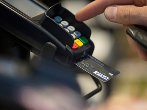 A customer enters their pin number while making a chip and pin payment.