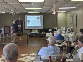 In this on Thursday, May 23, 2019 photo, Walter Hussman Jr., publisher of the statewide newspaper the Arkansas Democrat-Gazette, explains to members of the Hope, Arkansas Rotary Club how to access and use the paper's digital replica on an iPad in Hope, Ark. The newspaper will stop printing its daily paper by the end of the year and is distributing free iPads to all subscribers who transition to the daily digital version.