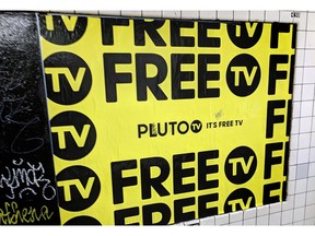 In this March 14, 2019, photo an advertisement for Pluto TV is displayed on the wall of a subway station in New York. Pluto is unusual in that it also offers dozens of channels with "live" video. Though some of these are pretty niche, dedicated to Minecraft or cats, the service is owned by Viacom, so you also get shows from well-known Viacom networks like MTV and Comedy Central.