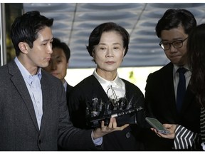 Lee Myung-hee, wife of the late Korean Air President Cho Yang-ho, center, arrives at the Seoul Central District Court in Seoul, Thursday, May 2, 2019. Lee on Thursday attended the opening trial on their charges including illegal hiring of a Filipino maid.
