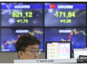 A currency trader watches monitors at the foreign exchange dealing room of the KEB Hana Bank headquarters in Seoul, South Korea, Monday, May 27, 2019. Shares were mixed early Monday in Asia in the absence of fresh news on the tariffs standoff between the U.S. and China.