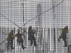 Construction workers work with steel rebar on May 17, 2019 in Miami, Florida. The Trump administration announced that within two days it will be lifting tariffs on Canadian and Mexican steel imports, nearly a year after imposing the duties.