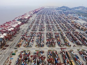 Shipping containers sit at the Yangshan Deepwater Port, operated by Shanghai International Port Group Co. (SIPG), in Shanghai, China. The U.S. hiked tariffs on more than $200 billion in goods from China on Friday in the most dramatic step yet of President Donald Trump's push to extract trade concessions, deepening a conflict that has roiled financial markets and cast a shadow over the global economy.