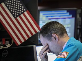 A trader works in the NYSE as markets plunged this month on increased trade tensions between U.S. and China.