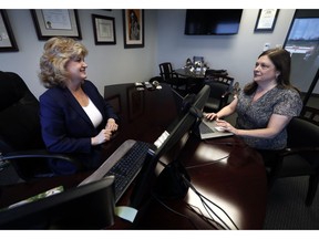 In this Tuesday, May 14, 2019, photo, business owner Meloney Perry, left, of Perry Law, talks with a member of her staff, attorney Karla Roush, at Perry's law firm in Dallas. Small business owners are making their company culture a bigger priority as they respond to the dramatically different expectations of a younger work force and a low unemployment rate that makes it harder to find staffers.