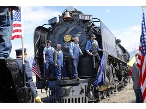 The crew from the Living Legend, No. 844 pose for a photograph during the commemoration of the 150th anniversary of the Transcontinental Railroad completion at Union Station Thursday, May 9, 2019, in Ogden, Utah.