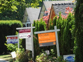 Homes for sale on a street in Vancouver.