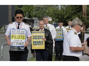Pilots demonstrating for better working conditions people who fly planes for Amazon.com and Atlas Air Worldwide picket outside Amazon.com's annual shareholders meeting, Wednesday, May 22, 2019, in Seattle.