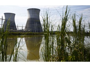 FILE - In this Wednesday, Sept. 7, 2016 file photo, two cooling towers can be seen in the reflection of a pond outside of the unfinished Bellefonte Nuclear Plant, in Hollywood, Ala. Real estate mogul Franklin Haney contributed $1 million to President Donald Trump's inaugural committee and all he's got to show for the money is the glare of a federal investigation. Haney's hefty donation is being scrutinized by federal prosecutors in New York investigating the group's finances. He's also in an unrelated legal battle with the owner of the Bellefonte Nuclear Power Plant, the Tennessee Valley Authority.
