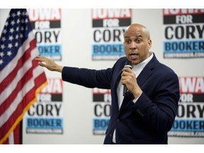 FILE - In this April 15, 2019 file photo, Democratic presidential candidate Sen. Cory Booker, D-N.J., speaks during an election stop at the Sioux City Public Museum in Sioux City, Iowa.  The campaign of presidential candidate Cory Booker is defending his decision to start a tech company while he was serving as mayor of New Jersey's largest city. A spokeswoman says that Booker "jumped at the chance" to start Waywire in 2012 because he saw it as a socially-conscious video network that could bring people together. But his one-time aspiration to be a tech mogul, and his long ties to the industry, could become a liability for his campaign.