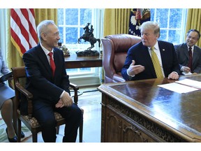 FILE - In this April 4, 2019, file photo, President Donald Trump meets China's Vice Premier Liu He in the Oval Office of the White House in Washington.