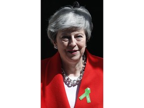 Britain's Prime Minister Theresa May leavse 10 Downing Street for her weekly Prime Minister's Questions at the House of Commons in London, Wednesday, May 15, 2019.