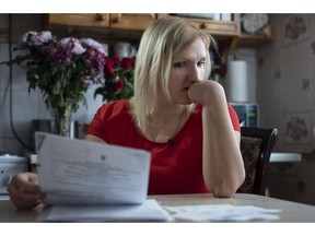 In this photo taken on March 11, 2019, Natalya Konkova sits during an interview with The Associated Press in Moscow, Russia. Konkova's son was one of nearly 130 Moscow children who were diagnosed with dysentery after eating food at one of the state-run day care centers and kindergartens in Moscow in December.