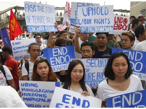 Protesters, mostly workers, gather for a rally prior to marching towards the Presidential Palace in Manila to pay tribute to workers in celebration of International Labor Day Wednesday, May 1, 2019 in the Philippines. The workers scored President Rodrigo Duterte allegedly for reneging in his campaign promise three years ago to end temporary hiring known as "contractualization" or "ENDO" (End of Contract).
