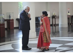 Iranian Foreign Minister Mohammad Javad Zarif, left, greets his Indian counterpart Sushma Swaraj before their meeting in New Delhi, India, Tuesday, May 14, 2019. Zarif's visit to New Delhi comes within days of the United States ending its waiver to India that allowed it to buy Iranian oil without facing American sanctions.