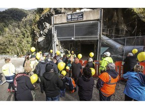 In this image released by the Pike River Recovery Agency, families gather at the entrance of the Pike River Mine, near Greymouth on the West Coast of New Zealand, Tuesday, May 21, 2019. Crews in New Zealand on Tuesday reentered an underground coal mine where a methane explosion killed 29 workers more than eight years ago, raising hopes among family members that they might find bodies and new evidence that leads to criminal charges.