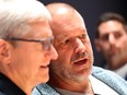 Jony Ive, centre, with Apple boss Tim Cook, left. The two often walked the Apple campus together making product decisions.