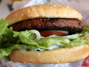 Aiming to satisfy demands of the so-called flexitarians, Tyson half-plant half-beef burger will have "fewer calories and less saturated fat" than other pure plant-based burgers, the company says. A Beyond Meat burger, above.