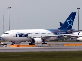 Air Transat jets prepare to take off at Montreal Pierre Elliott Trudeau International Airport. It remains to be seen if another takeover offer will hit new heights.