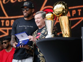 Kawhi Leonard accepts the key to the city from Toronto mayor John Tory after the Raptors won the NBA Championships.