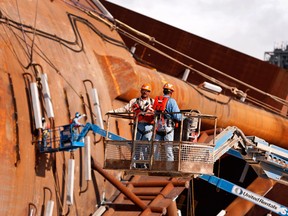 Contractors work on the hull of Anadarko Petroleum Corp.'s Lucius truss spar at the Kiewit Offshore Services facility in Ingleside, Texas.