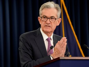 Fed Chairman Jerome Powell announcing the central bank's softened stance.