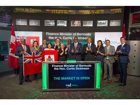 Bermuda Finance Minister Curtis Dickinson carries out a market-opening ceremony with members of a Bermuda delegation at the Toronto Stock Exchange (TSX) yesterday.