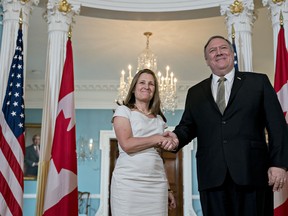Chrystia Freeland, Canada's foreign minister, left, shakes hands with Mike Pompeo, U.S. secretary of state, at the State Department in Washington, D.C., on Wednesday. Vice President Mike Pence last month promised the new trade pact between the U.S., Canada and Mexico will pass this year.