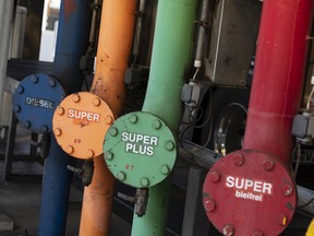 A row of colored petroleum outlet pipes stand at the Erik Walther GmbH oil terminal on the River Rhine in Schweinfurt, Germany.