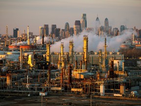 The Philadelphia Energy Solutions oil refinery is seen at sunset in front of the Philadelphia skyline March 24, 2014.