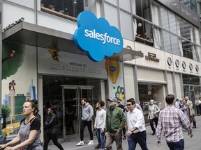 Pedestrians pass in front of the Salesforce Tower in New York on May 30.