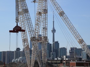 The downtown skyline and CN Tower are seen past cranes in the waterfront area envisioned by Alphabet Inc's Sidewalk Labs as a new technical hub in the Port Lands district of Toronto.