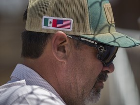 arlos Carreron wears a hat with a Mexican and American flag on it as he works at the Santa Teresa International Export/Import livestock crossing on June 05, 2019 in Santa Teresa, New Mexico.