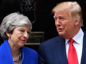 Britain's Prime Minister Theresa May greets U.S. President Donald Trump outside 10 Downing Street in London on Tuesday.
