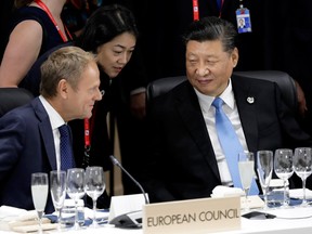 Xi Jinping, China's president, right, talks with Donald Tusk, president of the European Union (EU), left, prior to a working lunch on the first day of the G20 summit on June 28, 2019 in Osaka, Japan.
